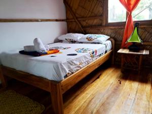 Voodi või voodid majutusasutuse Hostal Olmito Canoa toas