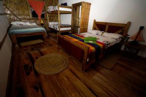 Voodi või voodid majutusasutuse Hostal Olmito Canoa toas