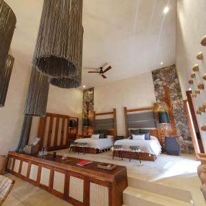 Postel nebo postele na pokoji v ubytování Oriundo Luxury Nature Villas
