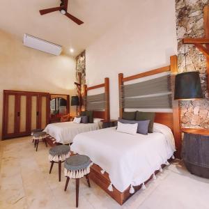Postel nebo postele na pokoji v ubytování Oriundo Luxury Nature Villas
