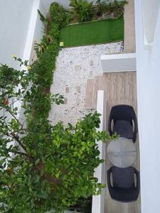 an overhead view of a patio with a plant at Enastron Cozy & Quiet Apartment in Heraklio