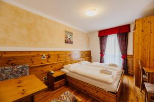 Posteľ alebo postele v izbe v ubytovaní Hotel Rosa Wellness & SPA