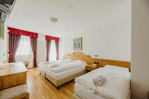 Posteľ alebo postele v izbe v ubytovaní Hotel Rosa Wellness & SPA