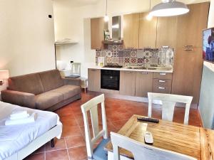 a living room with a couch and a table at That's Amore Cilento Country House in Agnone