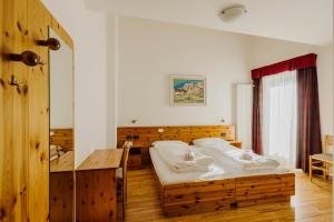 Posteľ alebo postele v izbe v ubytovaní Hotel Rosa Wellness & SPA