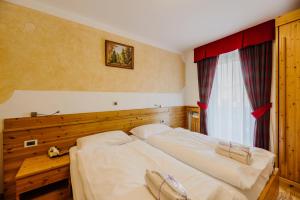 Posteľ alebo postele v izbe v ubytovaní Hotel Rosa Wellness & SPA