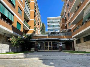 an external view of a building with a parking lot at Anastasio Vatican Rooms G H in Rome