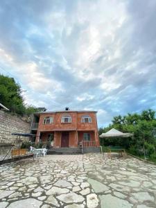 a large brick building with a patio in front of it at Green Garden in Ijevan