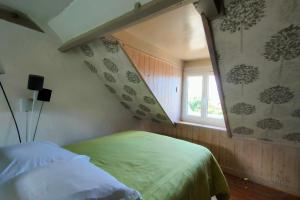 a bedroom with a green bed and a window at AL 11 - Villa "La Lisette" 8 personnes in Ault +63 photos