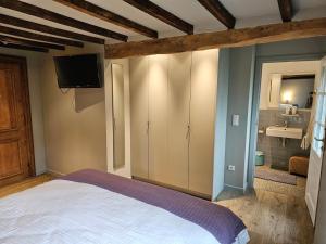 Postel nebo postele na pokoji v ubytování Eyckenmolen B&B