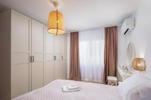 Postel nebo postele na pokoji v ubytování Kovač Family Suites