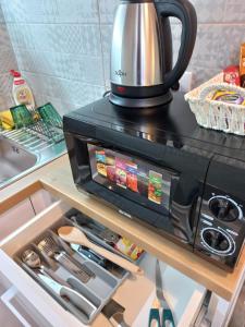 Kuchyň nebo kuchyňský kout v ubytování Apartments Balkanska City Center