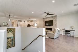 a living room with a ceiling fan and a couch at Walk to Downtown Cozy Lenoir Apartment! in Lenoir