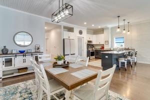 a kitchen and dining room with a table and chairs at Lenoir Apartment about 30 Mi to Grandfather Mountain in Lenoir