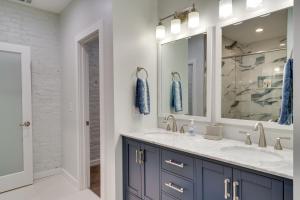 a bathroom with two sinks and a mirror at Walk to Downtown Cozy Lenoir Apartment! in Lenoir +23 photos