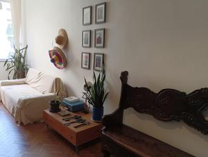 a living room with a couch and a coffee table at Apartamento Praia Leme Star in Rio de Janeiro