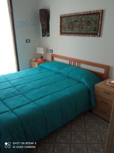 Säng eller sängar i ett rum på Casa del Gufo