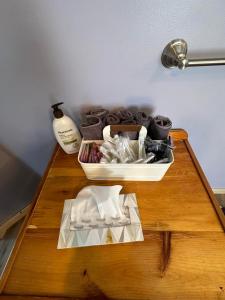 a wooden table with a tray of towels on it at Osceola #13 Mine House 