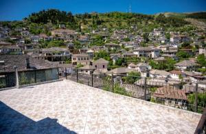 a view of a city from the roof of a house at Nina's Guesthouse in Gjirokastër