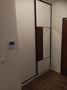 a room with a sliding glass door with a window at Apartament Zielone Tarasy in Rzeszów