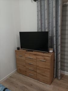 Μια τηλεόραση ή/και κέντρο ψυχαγωγίας στο Apartament Zielone Tarasy +10 φωτογραφίες