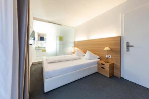 Postel nebo postele na pokoji v ubytování Hotel Goldener Stern