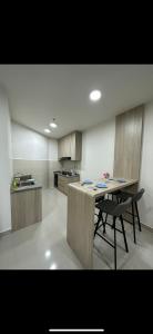 a kitchen with a table and a chair in it at Sea View The Shore Luxury Newly Renovated Homestay in Kota Kinabalu