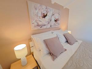 Postel nebo postele na pokoji v ubytování Apartments Nicole