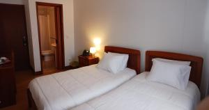 Postel nebo postele na pokoji v ubytování Hotel Insular