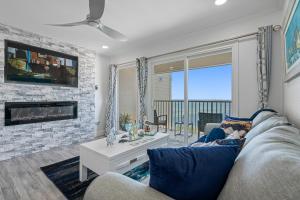 a living room with a couch and a fireplace at Sunset Paradise - Find yourself in Tampa in Tampa