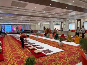 a person standing in a room with a table of food at Hotel shri siddhivinayak in Bīna-Etāwa