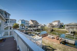 a balcony with a view of a marina at Holden Beach Home on Intracoastal Waterway Canal! in Holden Beach