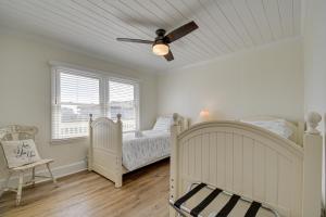 a bedroom with two beds and a ceiling fan at Holden Beach Home on Intracoastal Waterway Canal! in Holden Beach