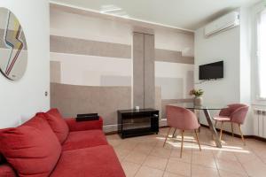 Telewizja i/lub zestaw kina domowego w obiekcie Exquisite Stay Vannucci- Porta Romana