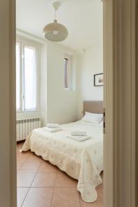 Łóżko lub łóżka w pokoju w obiekcie Exquisite Stay Vannucci- Porta Romana