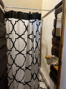 a shower curtain with a black and white pattern at Chilamate Rainforest Eco Retreat in Puerto Viejo