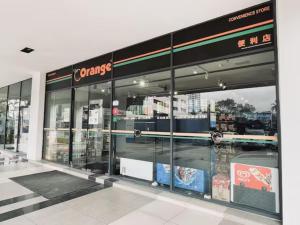 a store front with glass doors in a building at b.suites 21 in Kota Kinabalu