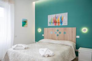 a bedroom with a bed with two towels on it at B&B DieMme Amalfi Coast in Vietri sul Mare +37 photos