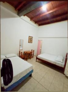 Un pat sau paturi într-o cameră la Hospederia Oasis