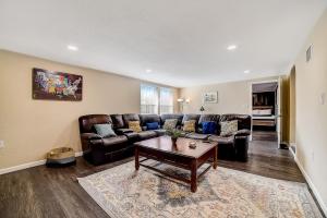 a living room with a couch and a table at Nash Boulevard Hideaway in San Antonio