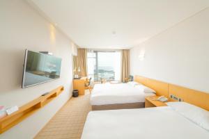Postel nebo postele na pokoji v ubytování Mstay Hotel