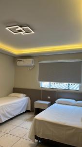 Postel nebo postele na pokoji v ubytování Hotel Pires Faxinal + 37 fotografií