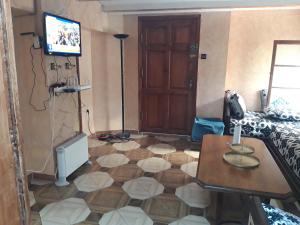 a living room with a tv and a floor at Tanger in Tangier