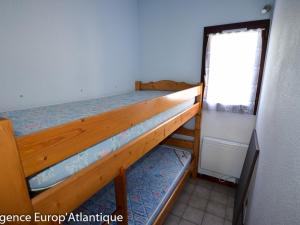 Poschodová posteľ alebo postele v izbe v ubytovaní Maison La Palmyre, 3 pièces, 4 personnes - FR-1-705-5