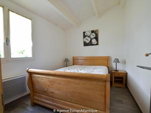 Postel nebo postele na pokoji v ubytování Maison La Palmyre, 4 pièces, 6 personnes - FR-1-705-16