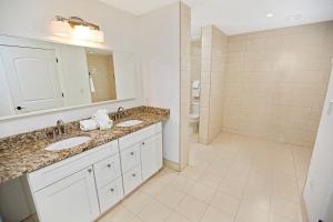 a bathroom with two sinks and a shower at Bali Bay 401 OV Myrtle Beach Hotel Room in Myrtle Beach