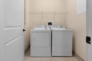 a kitchen with a white stove and a refrigerator at Bali Bay 404 OV Myrtle Beach Hotel Room in Myrtle Beach