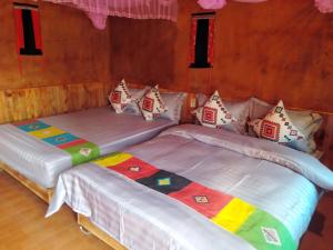 Ένα ή περισσότερα κρεβάτια σε δωμάτιο στο Diềm Bungalow +11 φωτογραφίες