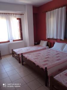 Postel nebo postele na pokoji v ubytování Maravelias Rooms