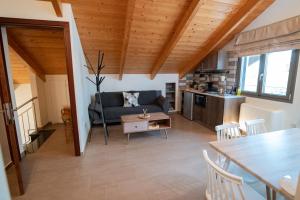 a living room with a couch and a table at Sofita με θέα τη θάλασσα Villa Athina in Preveza